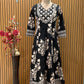 Black ethnic ensemble features elegant floral and vine prints