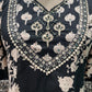 Black ethnic ensemble features elegant floral and vine prints