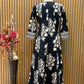 Black ethnic ensemble features elegant floral and vine prints