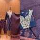 Elegant navy blue three-piece suit features floral embroidery on the neckline,
