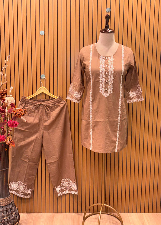 Stylish brown cotton co-ord set showcases elegant white floral