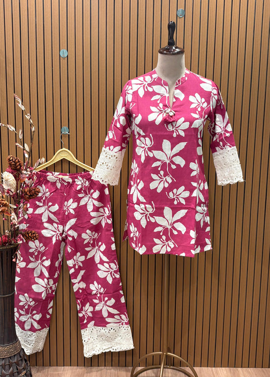 Vibrant magenta co-ord set features bold white floral prints