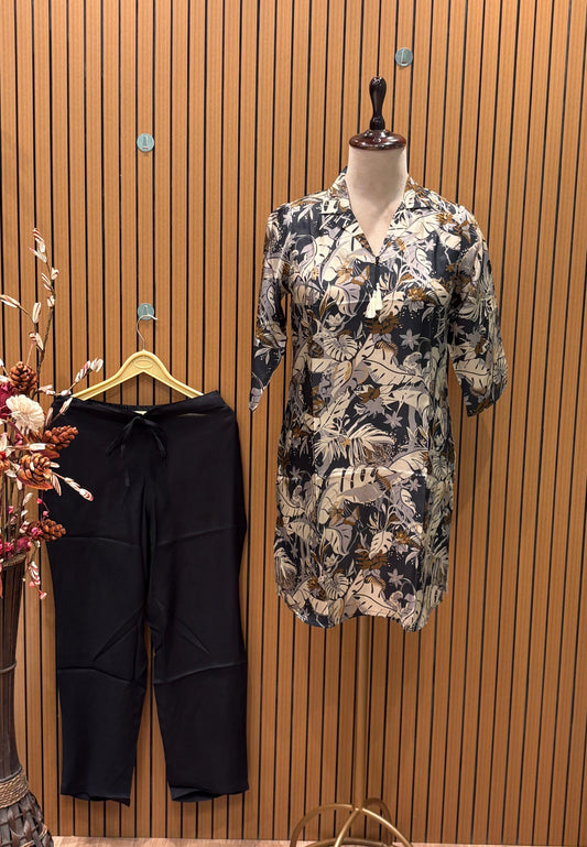 Trendy co-ord set features a dark tropical leaf