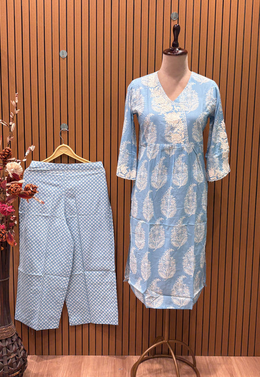Elegant kurti plazzo showcases a pastel blue kurti