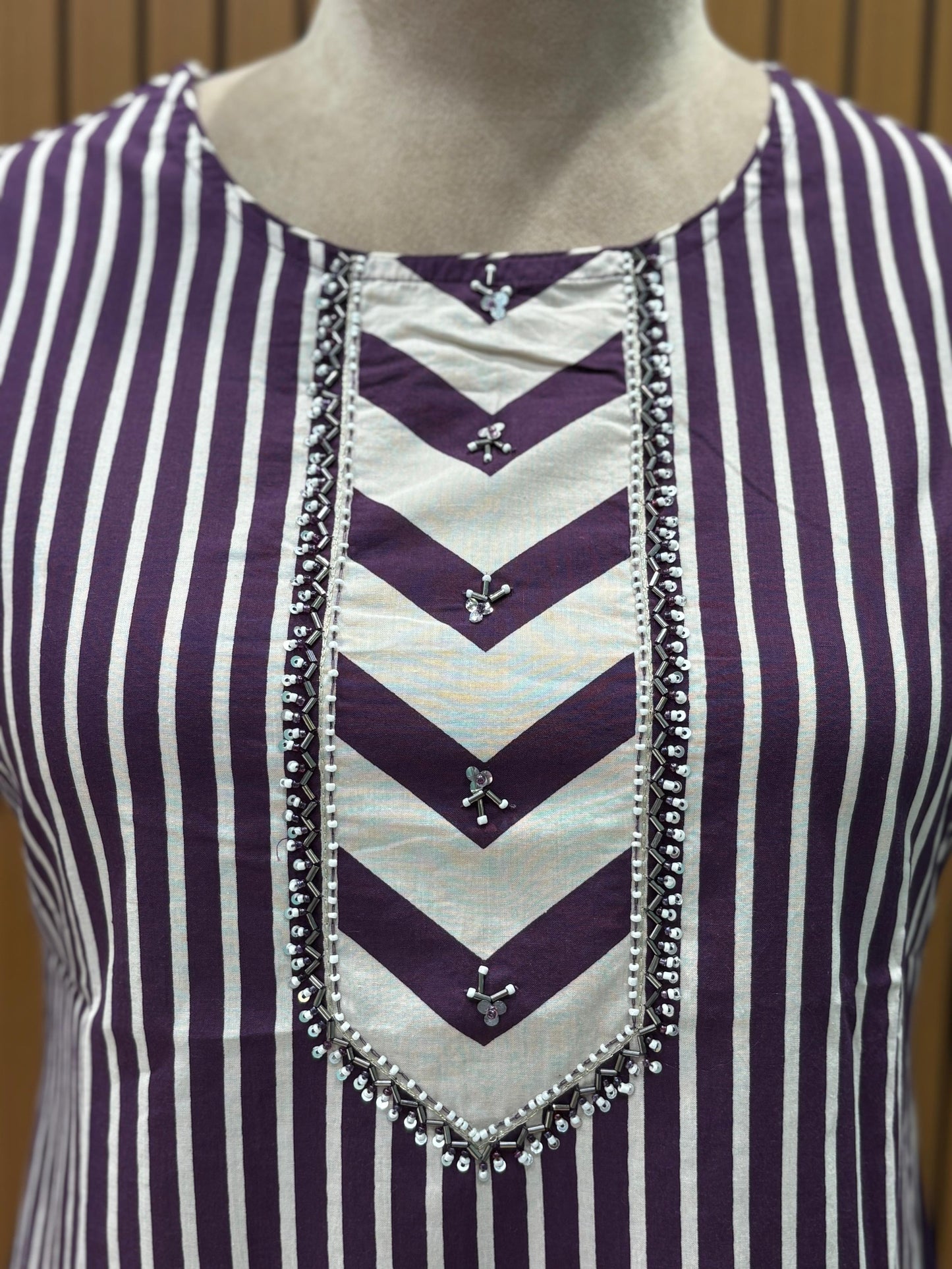 Elevate your ethnic style with this elegant purple cotton suit