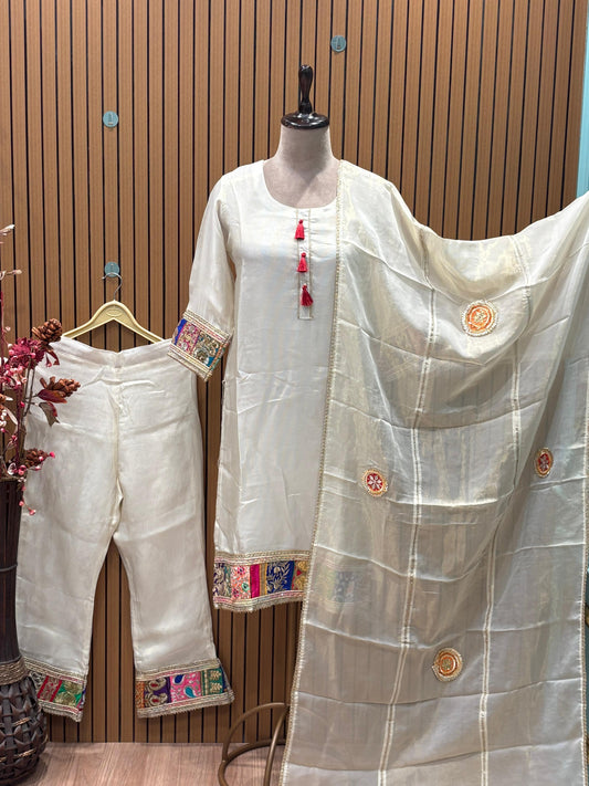Step into understated elegance with this ivory silk-blend kurti set