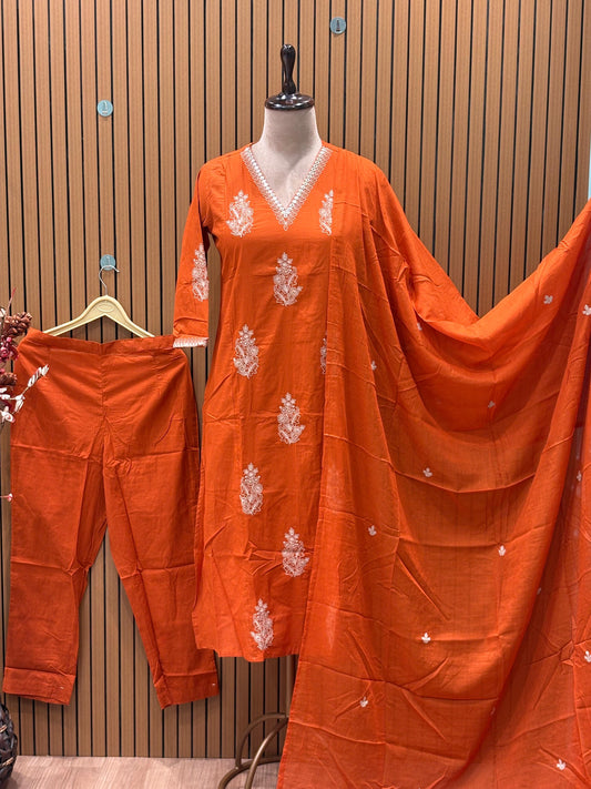 Radiate festive charm in this vibrant orange cotton suit