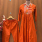 Brighten your wardrobe with this vibrant orange A-line kurti set