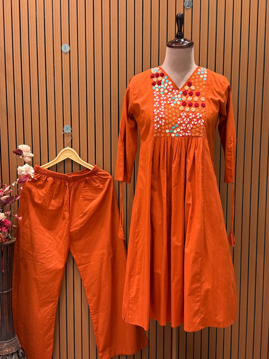 Brighten your wardrobe with this vibrant orange A-line kurti set