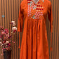 Brighten your wardrobe with this vibrant orange A-line kurti set