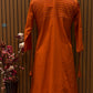 Brighten your wardrobe with this vibrant orange A-line kurti set