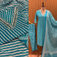 Make a statement in this vibrant turquoise kurti set