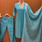 Make a statement in this vibrant turquoise kurti set