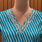 Make a statement in this vibrant turquoise kurti set