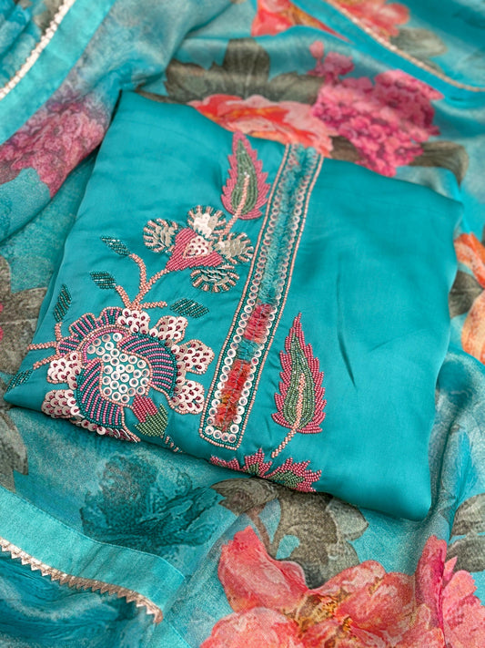 Unveil a graceful festive look with this unstitched suit set