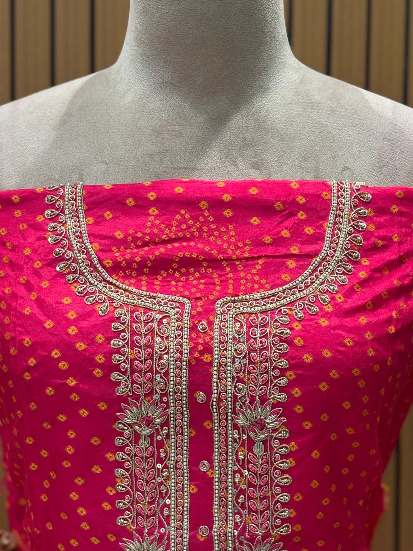 Add a regal charm to your festive wardrobe with this unstitched suit