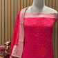 Add a regal charm to your festive wardrobe with this unstitched suit