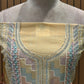 Presenting an elegant unstitched suit set in a soothing mustard-gold hue
