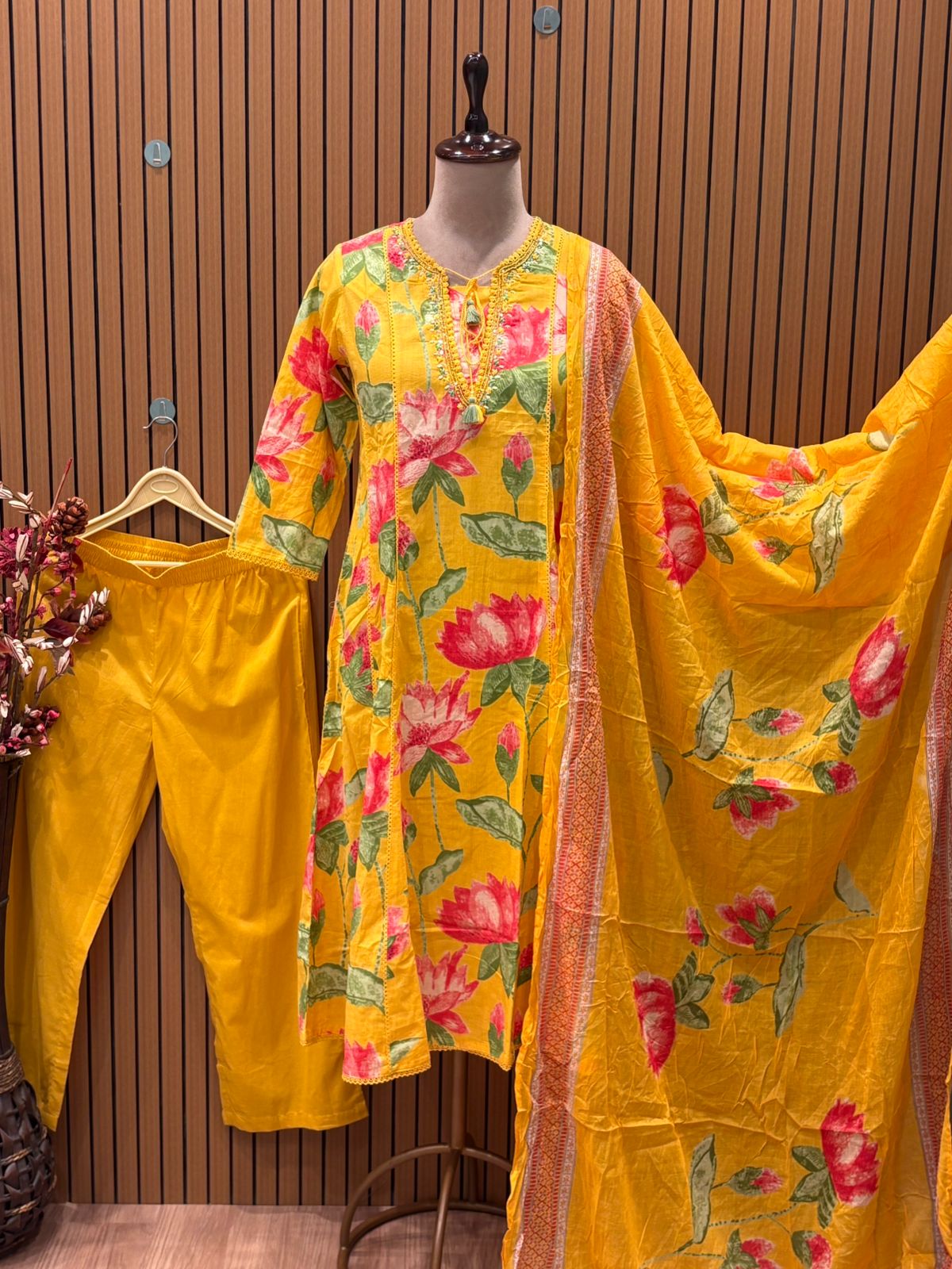 Brighten your festive wardrobe with this vibrant yellow A-line suit