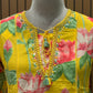 Brighten your festive wardrobe with this vibrant yellow A-line suit