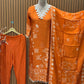 Orange cotton suit with shell mirror work neckline