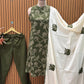 Sleeveless green flared dress with white swirl-leaf