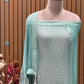 Elevate your festive wardrobe with this exquisite ensemble crafted