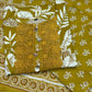Embrace festive charm with this mustard floral print suit