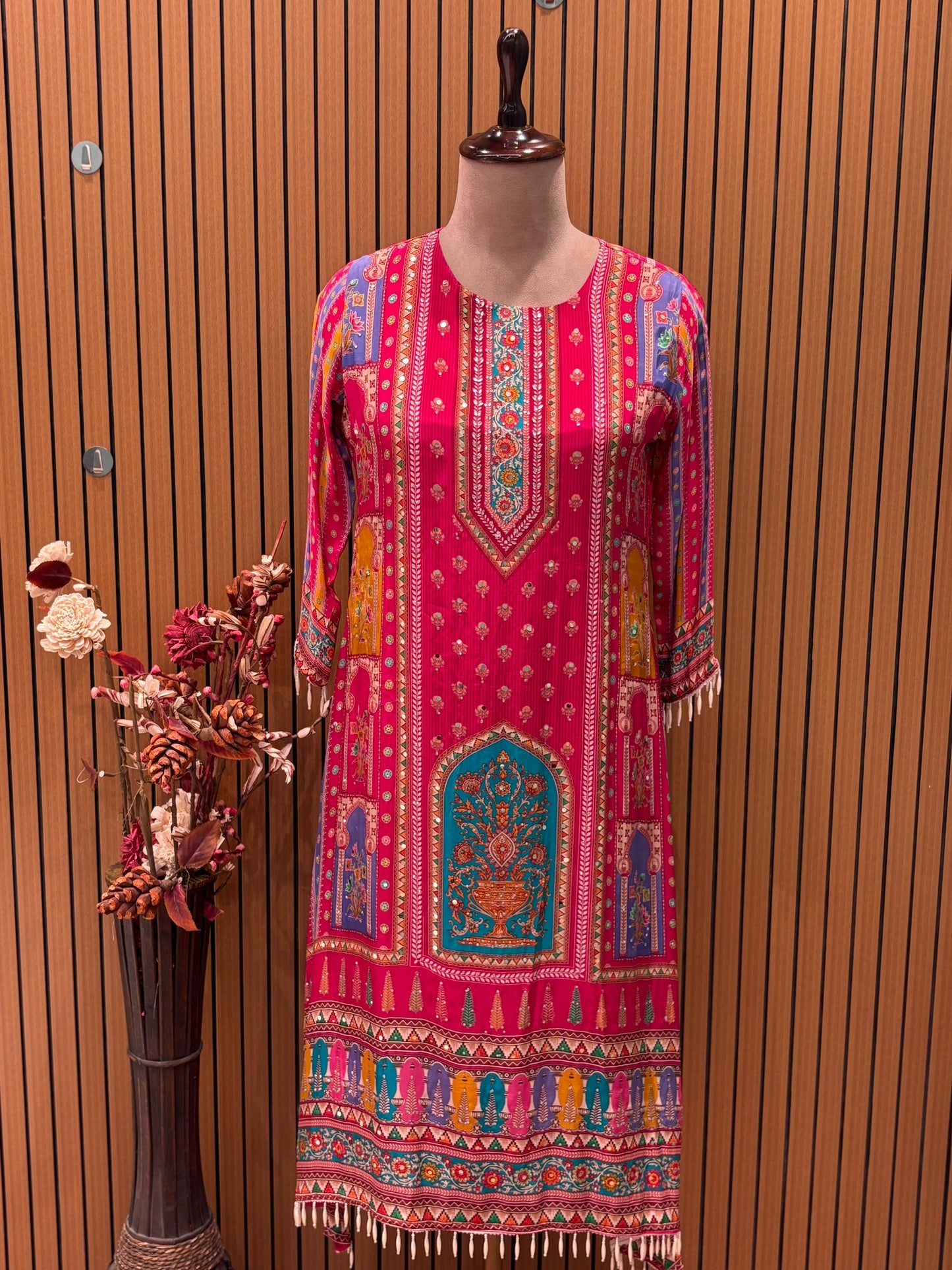 Brighten your wardrobe with this vibrant pink printed kurti