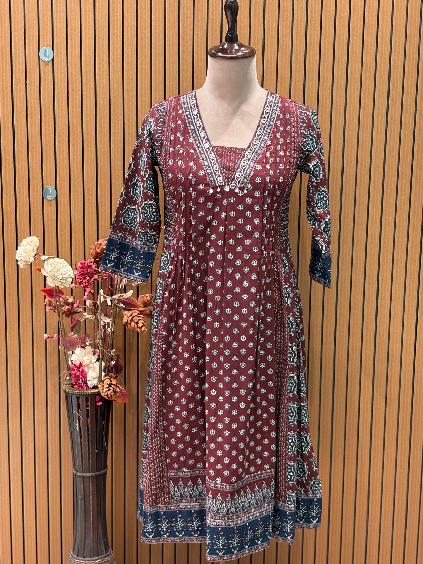 Elevate your everyday style with this maroon A-line cotton kurti set