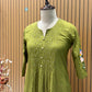 A soft and breathable cotton fabric in a rich olive green shade