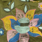 A soft and breathable cotton fabric in a rich olive green shade