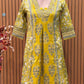 Vibrant yellow Anarkali set in pure cotton features intricate ethnic prints