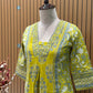 Vibrant yellow Anarkali set in pure cotton features intricate ethnic prints