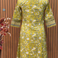 Vibrant yellow Anarkali set in pure cotton features intricate ethnic prints