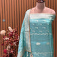 Unveil festive elegance with our luxurious unstitched suit