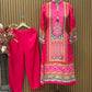 Radiate festive charm in this vibrant pink crape suit set