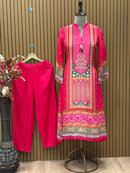 Radiate festive charm in this vibrant pink crape suit set