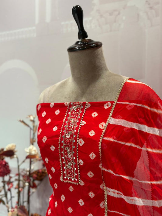 Unstitched elegance meets tradition in this stunning Bandhej print suit set