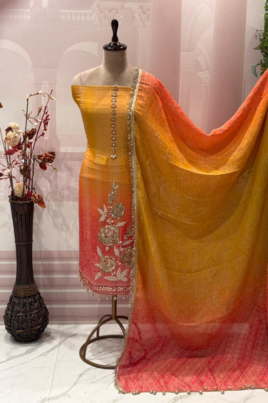 Exquisite unstitched suit set is crafted from premium crush tissue shimmer fabric