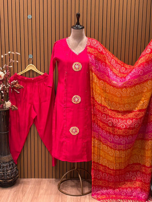 Grace your festive wardrobe with this vibrant pink muslin kurti set,