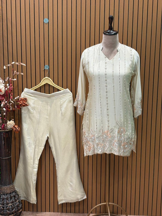 Elegant short kurti in premium tissue shimmer with intricate handwork