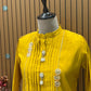 Brighten your festive look with this mustard muslin kurti set