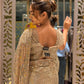 Gold shimmer soft-net saree featuring a stitched blouse