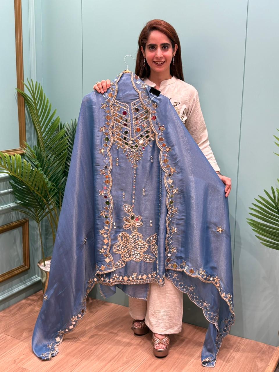 Organza Shimmer Unstitched Suit featuring all-over mirror work