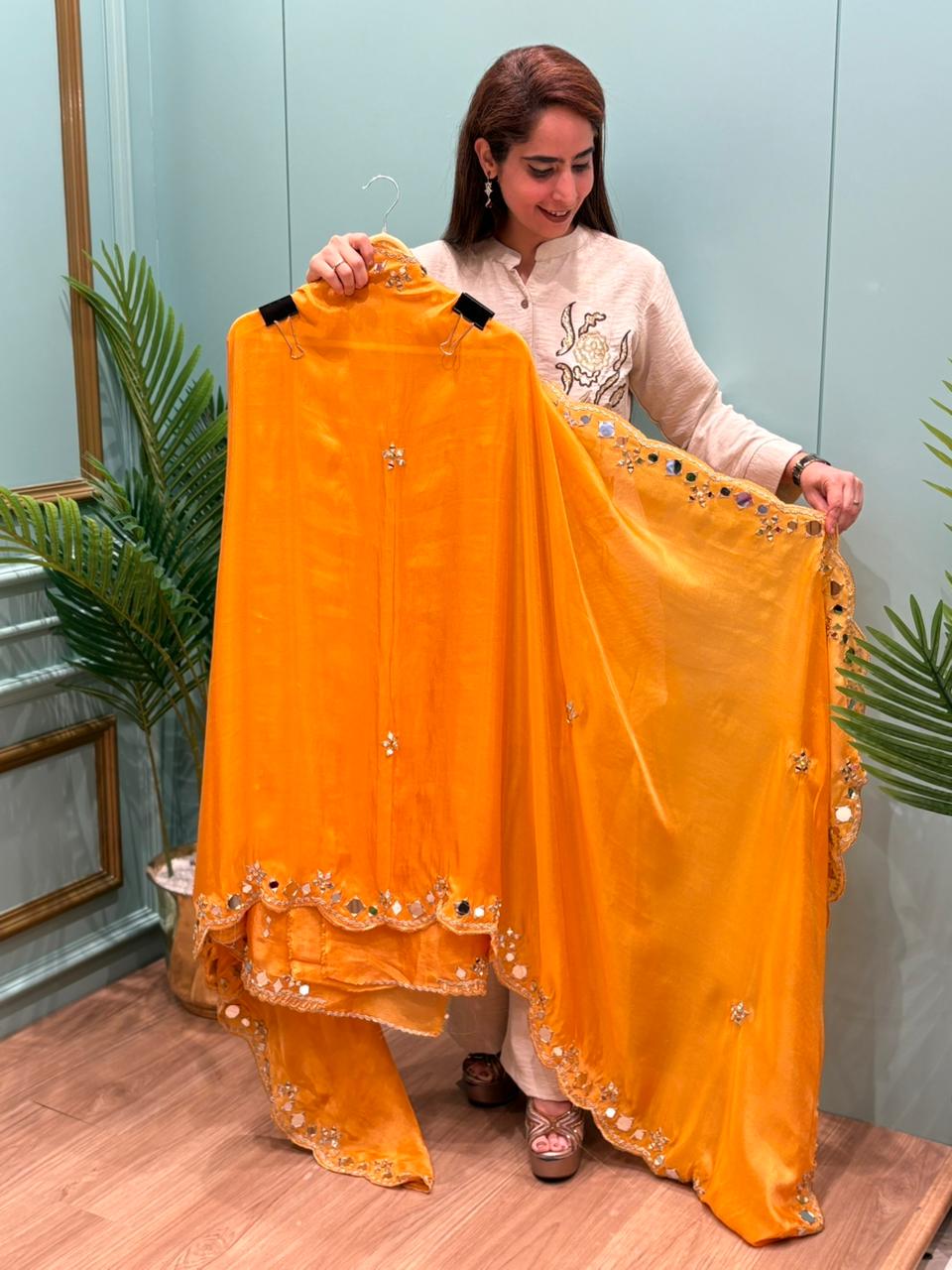 Organza Shimmer Unstitched Suit featuring all-over mirror work