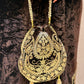 Royal velvet outfit with intricate golden embroidery and handcrafted potli bag