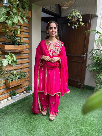 Exquisite short Anarkali set is beautifully crafted in luxurious Upada silk