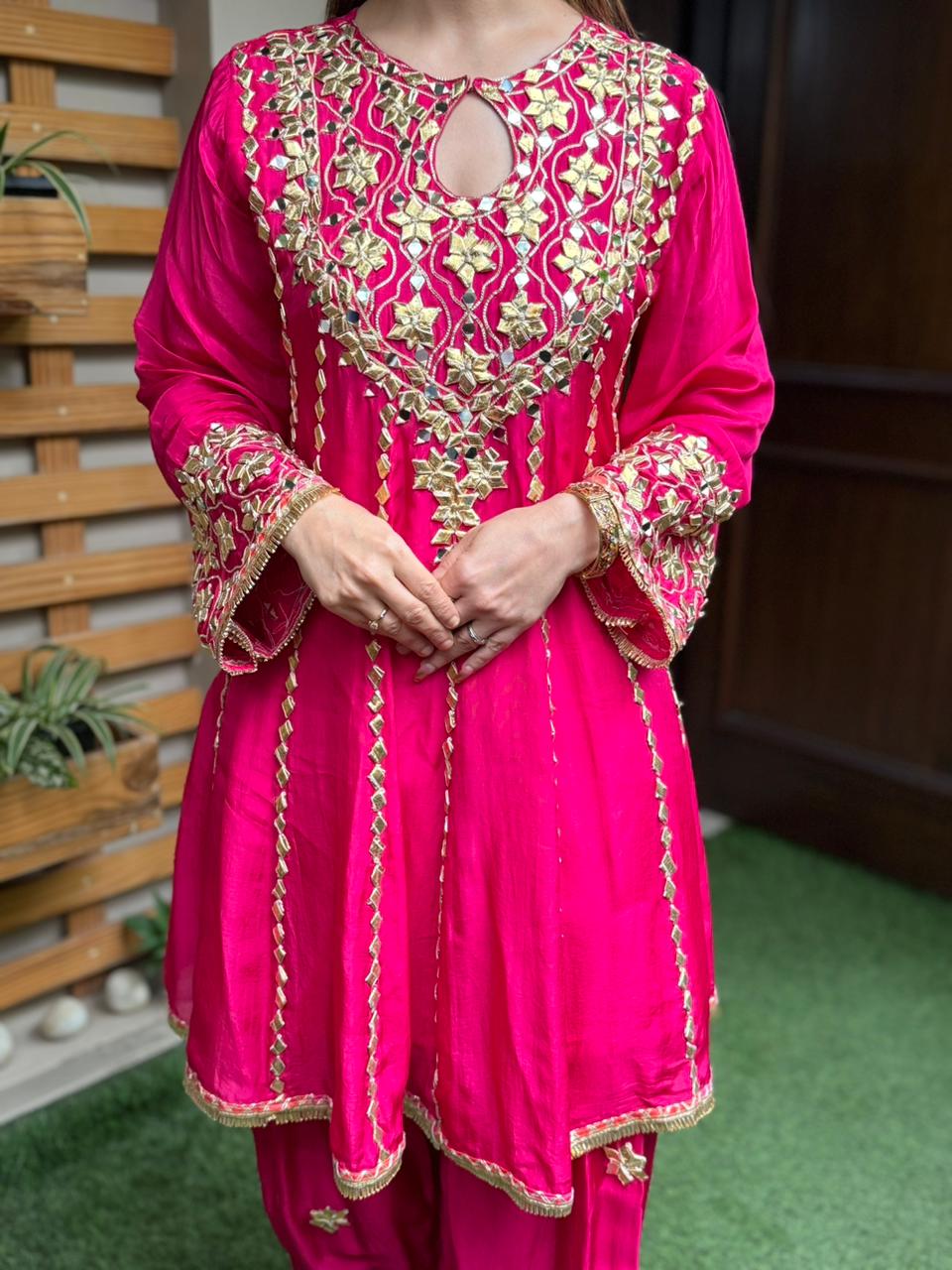 Exquisite short Anarkali set is beautifully crafted in luxurious Upada silk