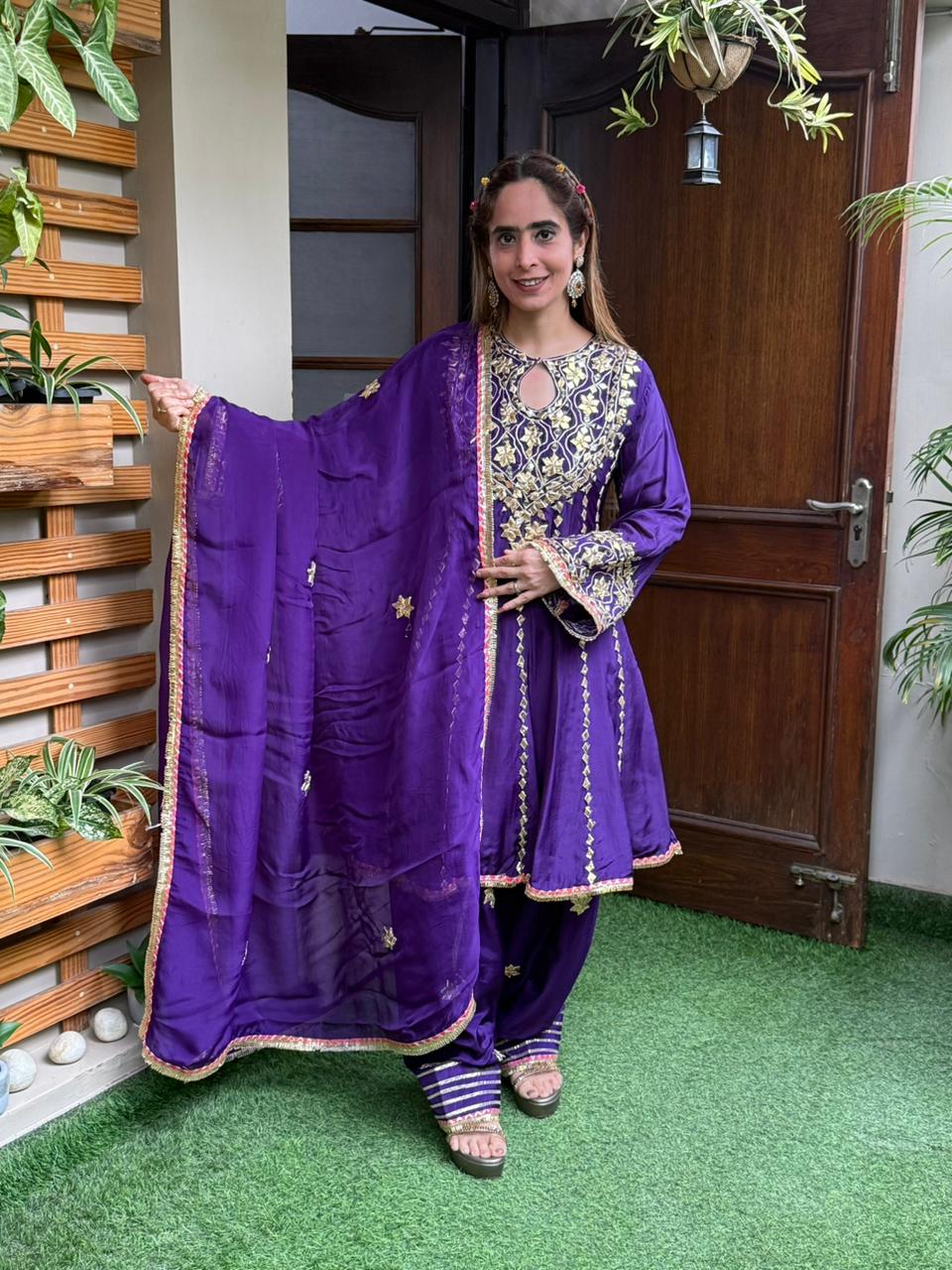 Exquisite short Anarkali set is beautifully crafted in luxurious Upada silk